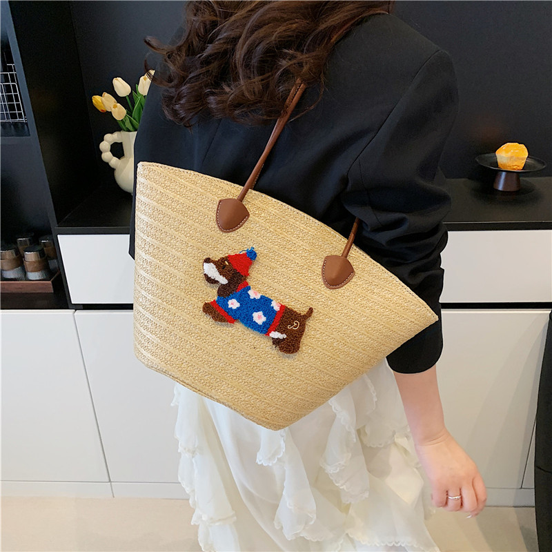 Venta caliente de verano bolso tejido caliente femenino 2025 nuevo bolso de cubo de playa de vacaciones bolso de paja de gran capacidad