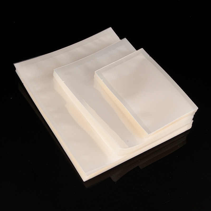 Bolsa sellada brillante Bolsa de embalaje de plástico para alimentos Bolsa de embalaje al vacío gruesa al por mayor Bolsa de plástico al vacío transparente fácil de rasgar