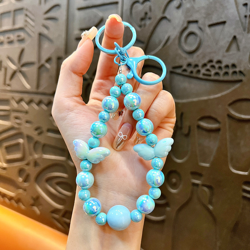 Sala de transmisión directa con alas recuerdos llaveros lindos colgantes de teléfonos móviles accesorios de bolsos llaveros de automóviles al por mayor