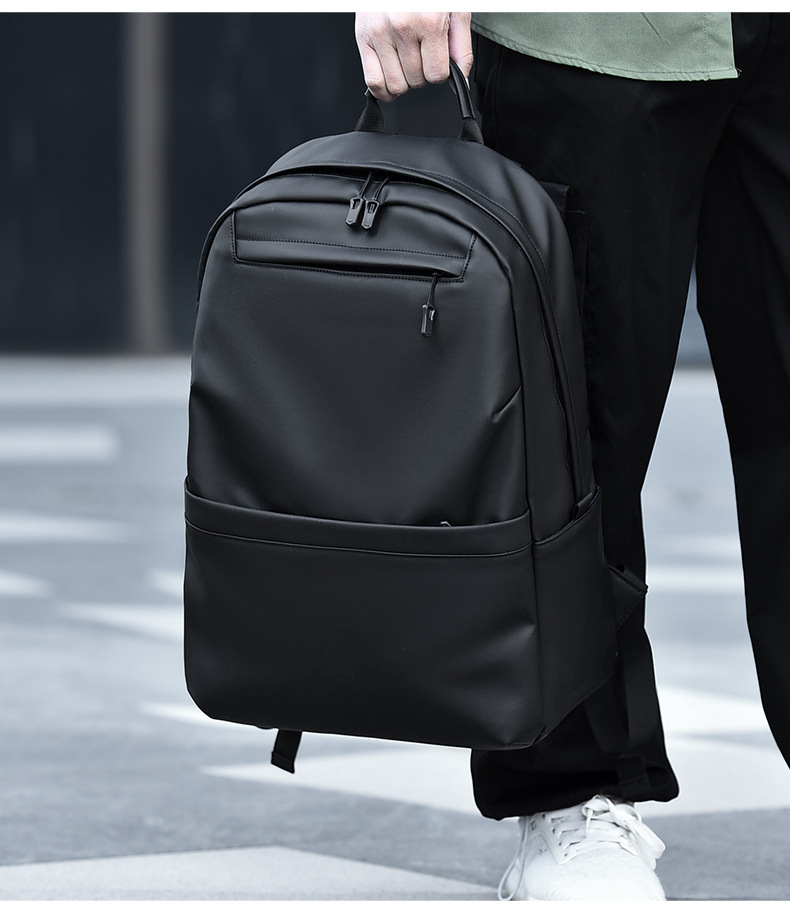 A new minimalist backpack for men, a Korean-style casual and fashionable backpack for laptops, with a logo printed on it undefined
