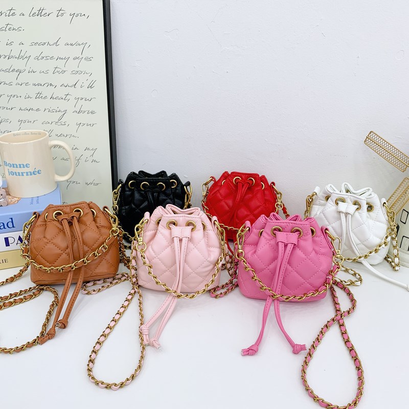 Bolso de hombro para niños y niñas Lingge de moda, cordón de aire extranjero, bolso de cubo de bebé de color sólido simple, nuevo bolso de cadena para niños