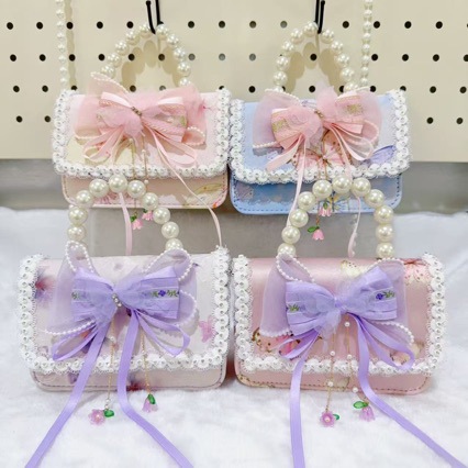 Otoño nuevo bolso infantil princesa perla bolso de mano pequeña fragancia chica bolso de moda bebé portátil