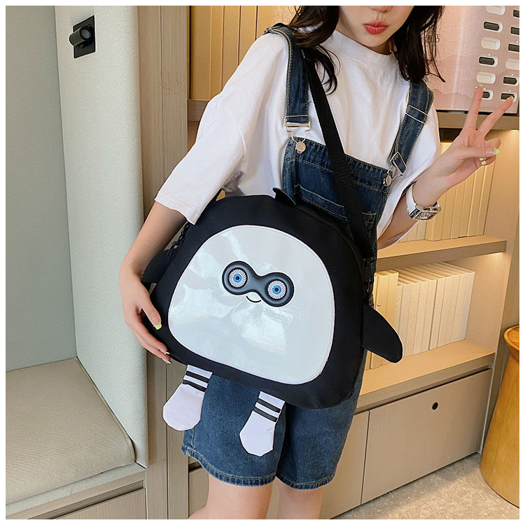 The new 2024 children's egg-shaped party backpack is a cute cartoon canvas single-shoulder bag and a fashionable and stylish small backpack undefined