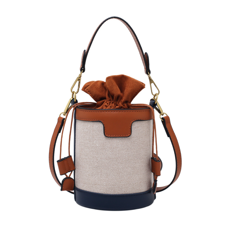 Bolso tipo cubo para mujer, nuevo estilo coreano 2026, bolso de hombro cilíndrico, bandolera retro de lona con bloques de color, a la moda