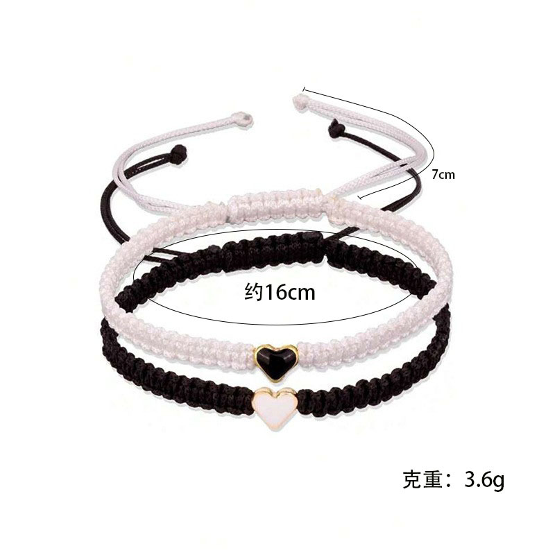 Joyería transfronteriza europea y americana en forma de corazón pulsera tejida a mano pulsera de pareja de amor de las mujeres pulsera de corazón de melocotón blanco y negro al por mayor
