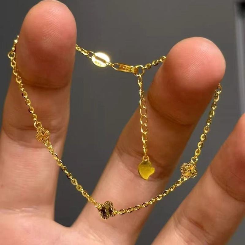 新しいライトラグジュアリーで絶妙なゴールデン四つ葉のクローバー三つ花ブレスレット、女性用ニッチデザイン、多用途でハイエンドのハンドジュエリー|undefined