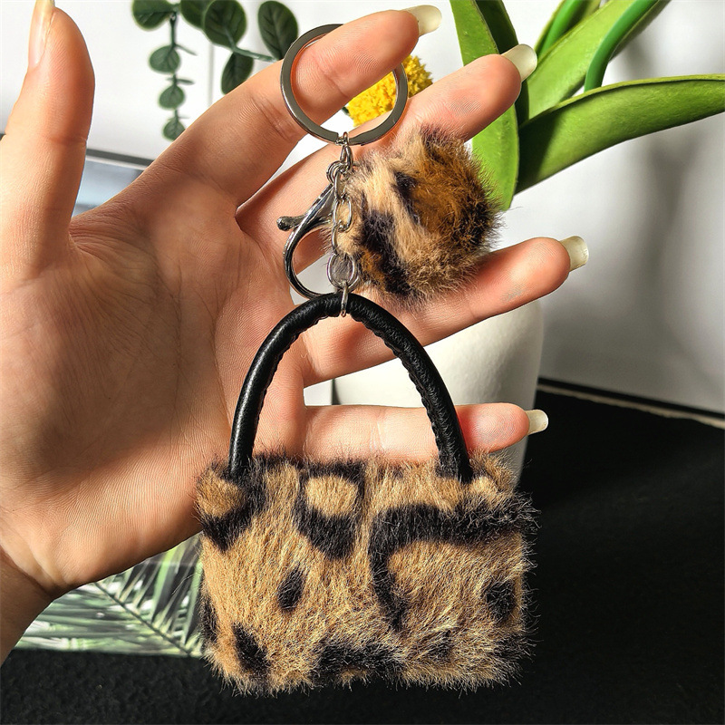 Leopardo bolso de peluche llavero de dibujos animados creativos accesorios bolso accesorios de peluche bola accesorios colgante llavero de coche
