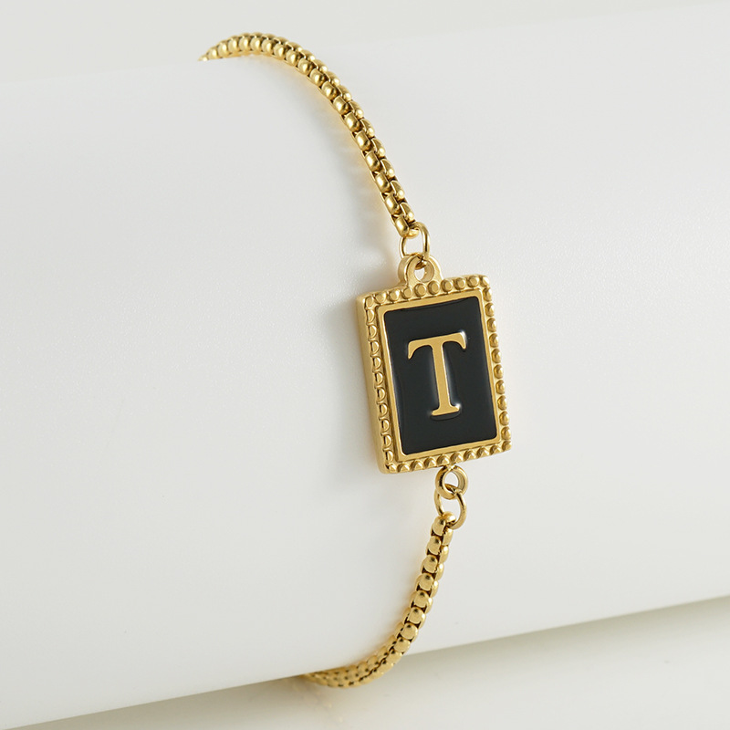 La moda europea y americana transfronteriza del acero inoxidable 26 pulsera inglesa de la letra en relieve pulsera Titanium de la cremallera del acero 18K de la frontera para las mujeres