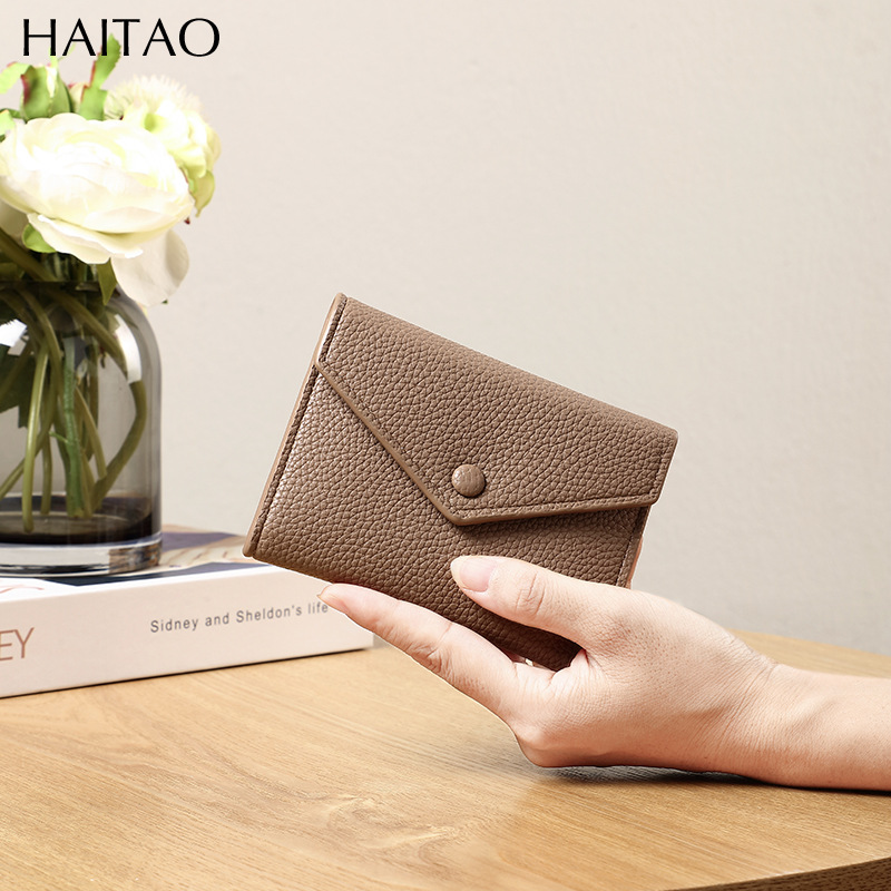 Cartera de mujer corta simple cartera plegable de tres pliegues japonesa y coreana de moda nuevo sobre bolso de cambio transfronterizo