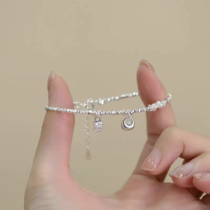 925 Silver-Plated Small Lucky Bag Bracelet with Unique Design, Versatile Silver Fragments, Light Luxury and High-End Feel, New Model for Women 2026 925 Silver-Plated Small Lucky Bag Bracelet with Unique Design, Versatile Silver Fragments, Light Luxury and High-End Feel, New Model for Women 2026