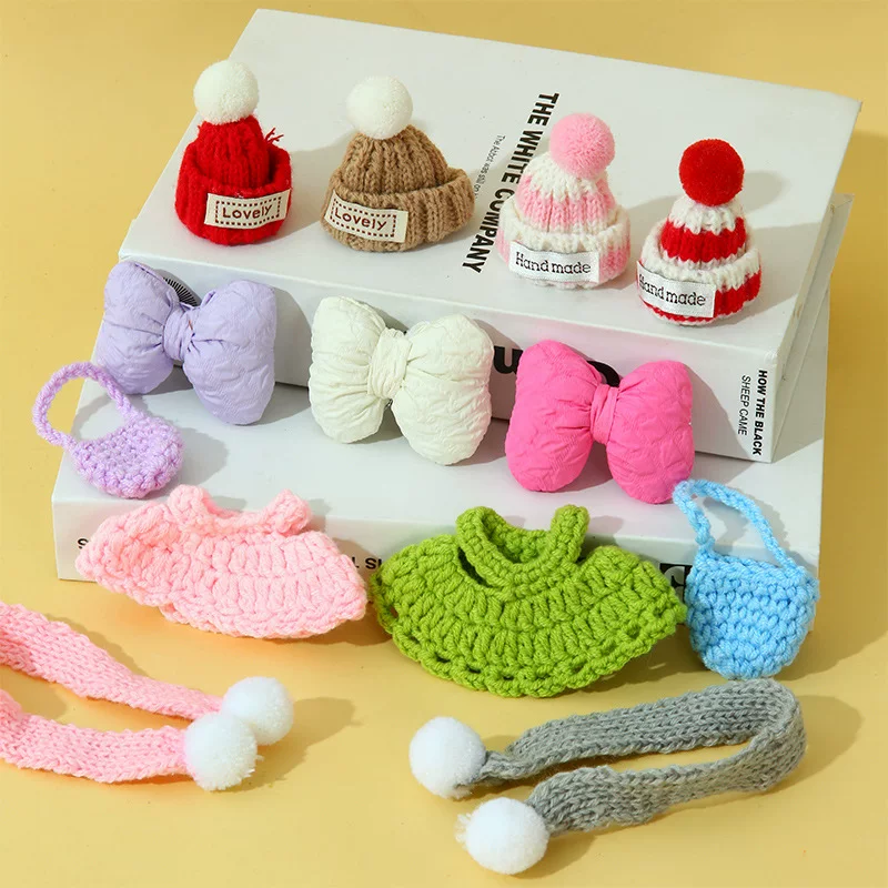 Small cute knitted hat, scarf with bow, small bag, pack, accessory