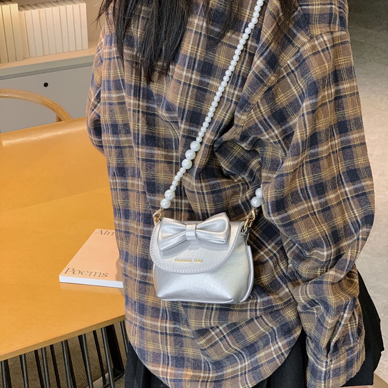 Cute mini niñas bolso de hombro dulce perla bolso de bebé coreano nuevo bolso de cambio de color sólido para niños