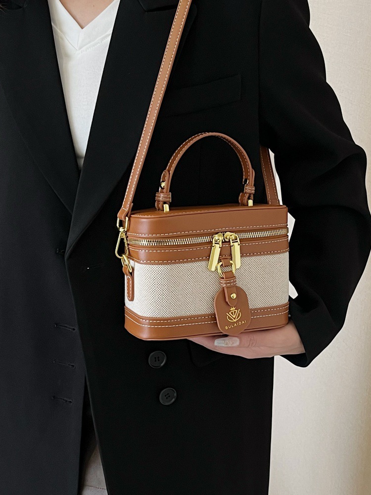Bolso de mano de alta sensación para mujeres 2025, nueva moda transfronteriza, bolso de caja de empalme de color, bolso casual, bolso cuadrado simple