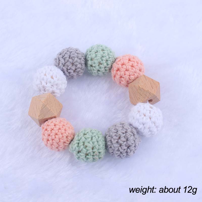 Nueva historieta del bebé haya amor mordedor juguete DIY macaron gran bola de lana mordedura pulsera