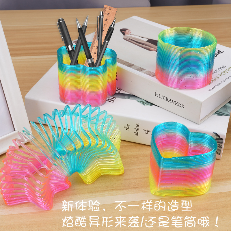 Venta caliente grande en forma de anillo Arco Iris puestos populares juguete mágico primavera anillo Yiwu juguete al por mayor