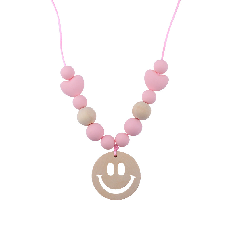 Nuevo bebé suministros smiley cara mordedor collar bebé cuentas de silicona mordida molar masticable colgante collar