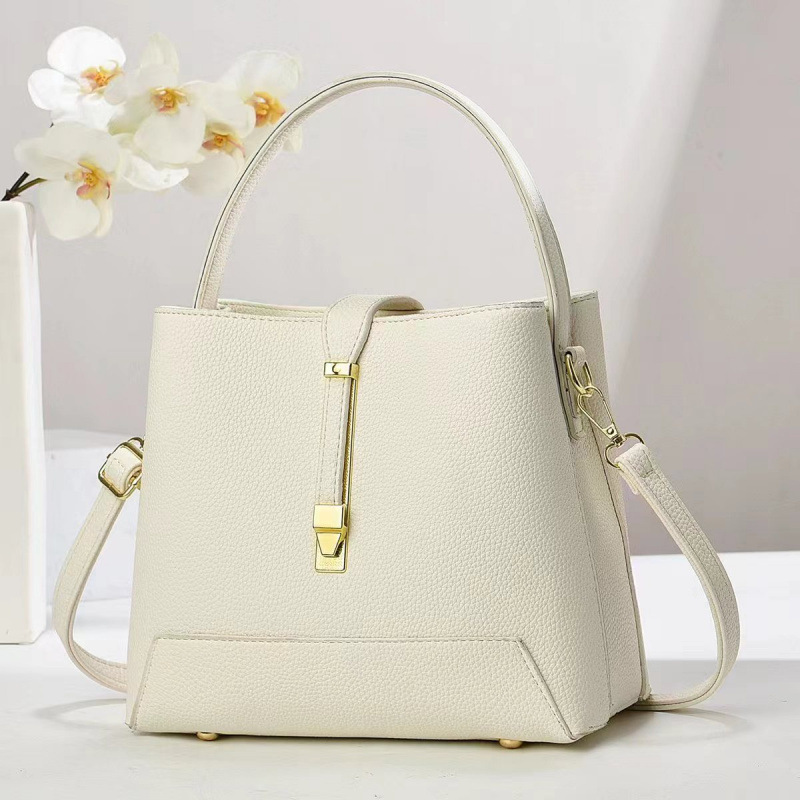 Fabricante bolsos de mujer 2025 nuevo bolsos de mano texturas coreanas de hombro de una sola forma de bolsos de cubo de mujer bolsos
