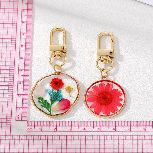 Cross-border e-commerce colorful glue dried flower keychain popular pastoral style daisy transparent flower pendant bag pendant