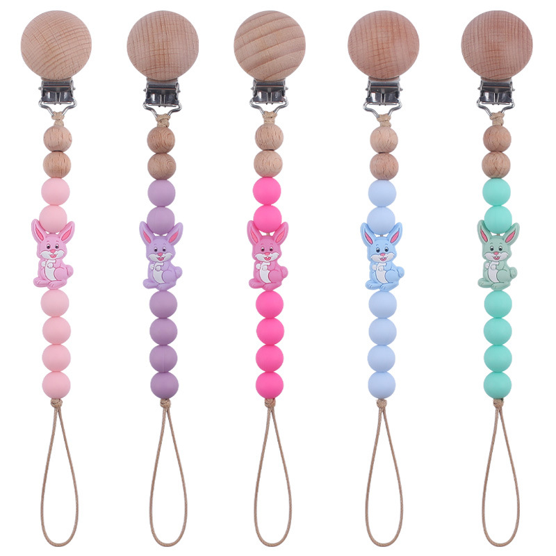 Nuevo bebé suministros dibujos animados conejo mordedor creativo lindo DIY mordedura molar pezón cadena anti-gota cuerda de la cadena
