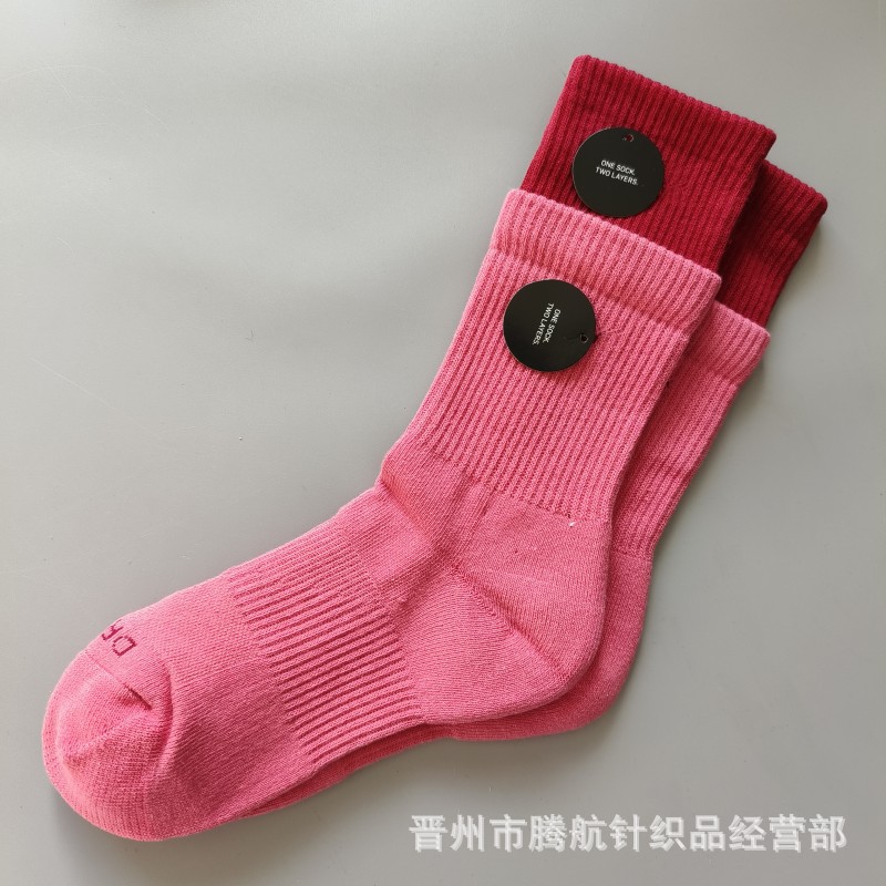 蘇万ナイキの靴下のカラーの二重は男女の中で長い筒のタオルの底のスポーツの靴下をつなぎ合わせてバスケットボールの靴下を走ります。