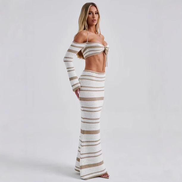 Conjunto de verano para mujer, estilo europeo-americano, con top halter de manga larga a rayas y falda, ideal para cruzar fronteras (2026)._voghion.com