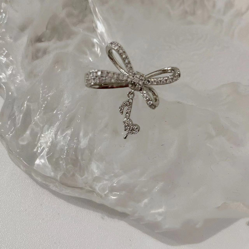 S925 Corea del Sur Luz de lujo completo diamante bowknot nota nicho diseño sentido earless oreja pendientes clip [un paquete]