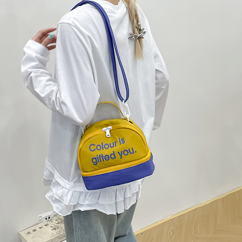Bolso de moda coreana 2025 nuevo bolso femenino de lona estilo universitario letra bolso de hombro bolso de mensajero de color de contraste casual