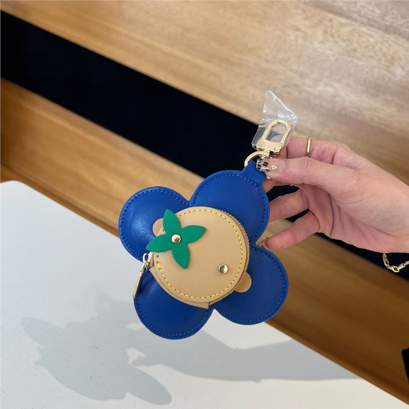 2025 nuevo solar flor de llaves bolsas de monedas bolsas de nicho de cuero bolsas colgantes bolsas de polvo de auriculares