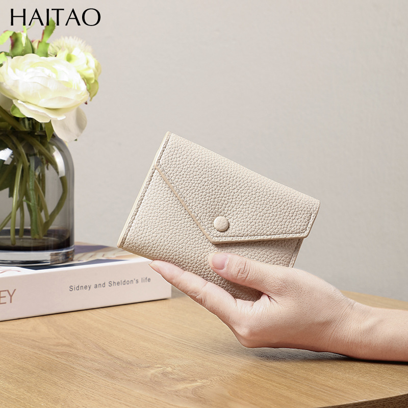 Cartera de mujer corta simple cartera plegable de tres pliegues japonesa y coreana de moda nuevo sobre bolso de cambio transfronterizo