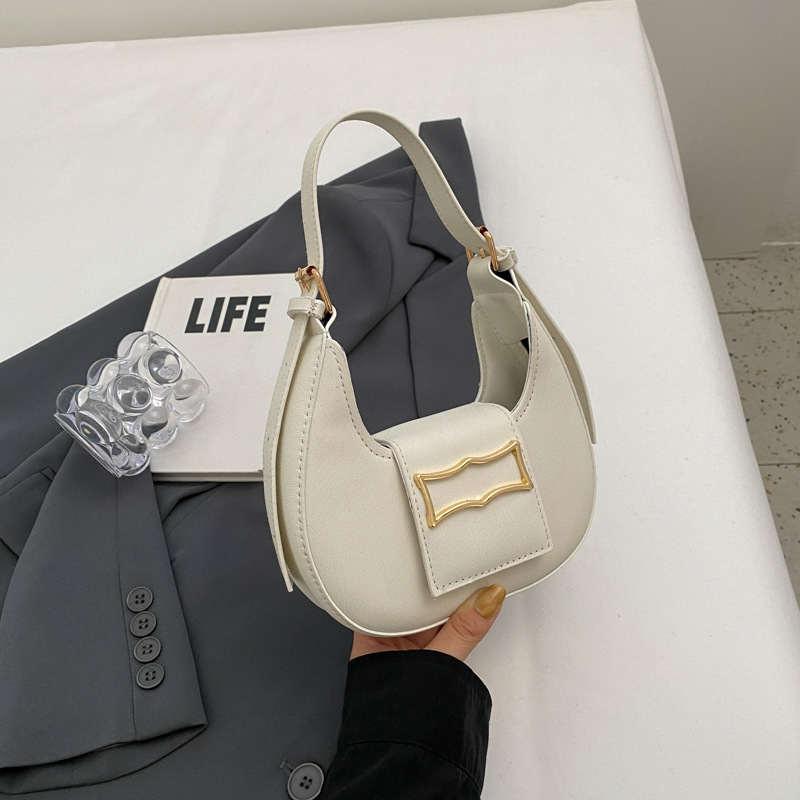 Temperamento simple y de moda 2024 color sólido primavera ocio popular de este año, estilo occidental, bolso portátil de un solo hombro y axila