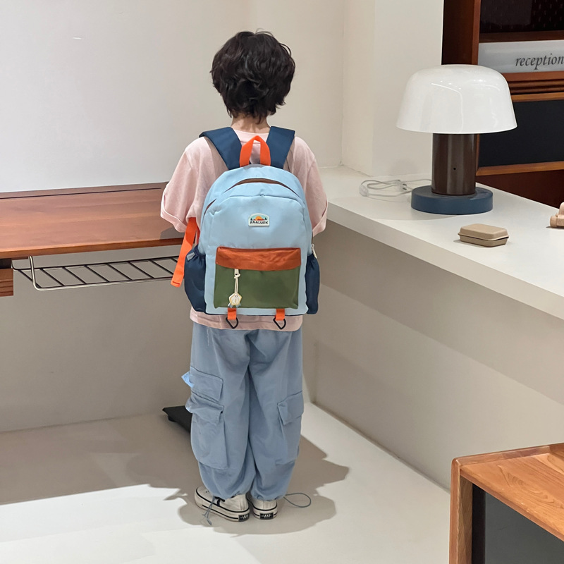2025 mochila de moda coreana para niños y niñas, mochila para niños de jardín de infantes, nueva mochila para niños de color exterior