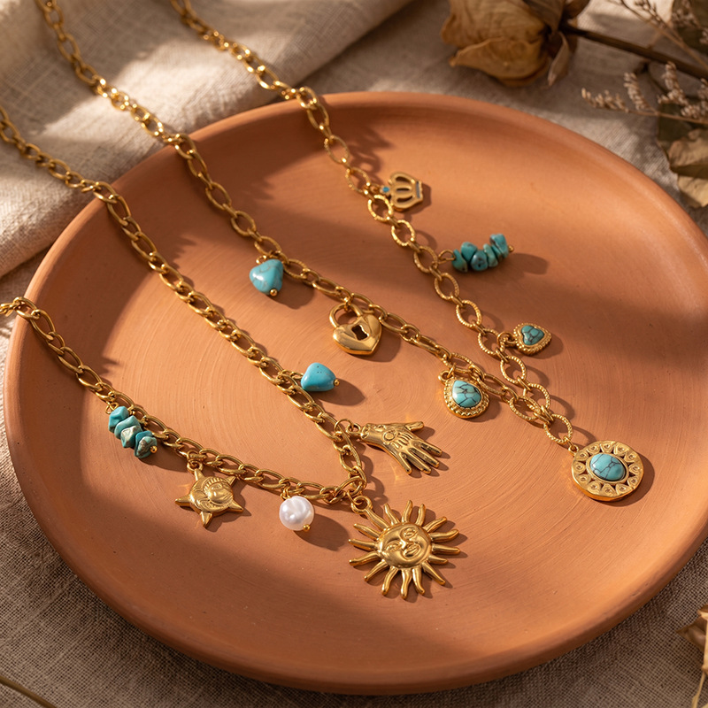 TENA Europa y América de moda titanio collar de colgante de sol lujo ligero de alto nivel incrustado colgante de color turquesa al por mayor