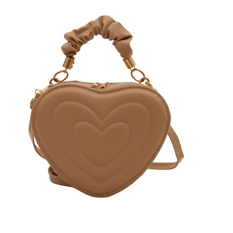 2024 otoño y invierno de mujeres nuevas caramelo de cáscara dura bolso de hombro de color corazón bolso de moda bolso de amor amor amor impresión
