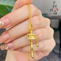 金店の同じタイプの古法沙金は六字の箴言を入れて金の筒のペンダントを回転します。