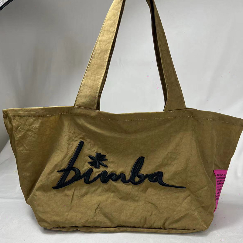 Venta directa de fábrica, bolso de tela español Bimba y Lola, nuevo bolso de mano para mujer de color puro, bolso de mano para mujer, bolso tipo clutch para mujer