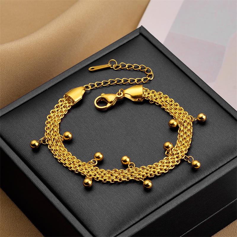 Europa y los Estados Unidos venden joyería pulsera de arena con cuentas Zhou Jia con pulsera de acero de titanio chapado en oro para mujeres no se desvanecen joyerías de mano
