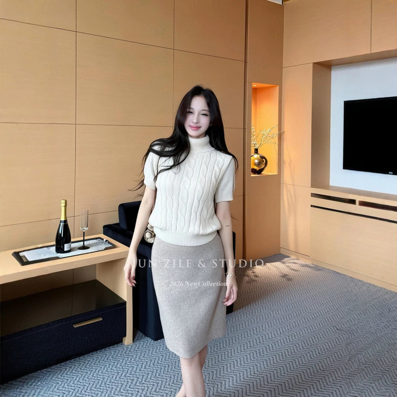 Elegant women's outfit: high-neck knitted sweater top, fitted short-sleeved pullover, and A-line midi skirt for work Elegant women's outfit: high-neck knitted sweater top, fitted short-sleeved pullover, and A-line midi skirt for work