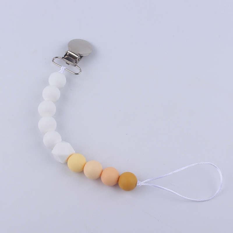 Nuevos suministros para bebés Cadena de chupete DIY creativo contraste color cuentas de silicona mordedor anti-caída traje de cadena