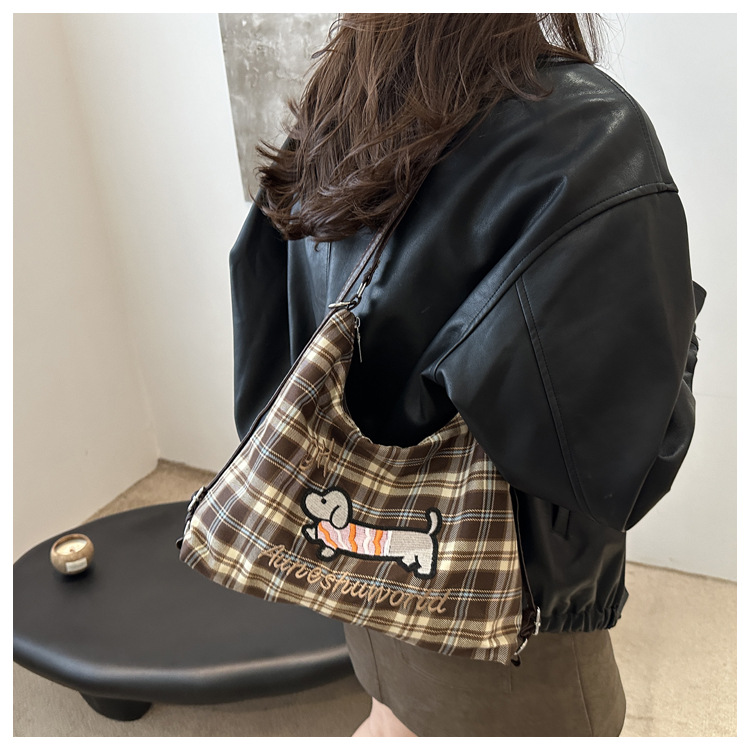 A new 2024 trendy and stylish backpack for women, featuring a cartoon checkered single-shoulder crossbody bag and a tote bag undefined