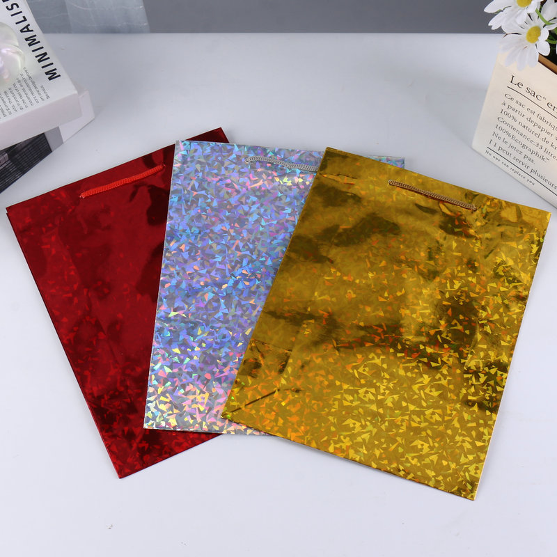 Cool papel de bronce láser bolsas de papel de mano de alta sensación de color láser regalo de cumpleaños bolsa de regalo de vacaciones