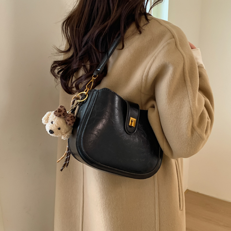 Vintage cera de piel debajo de la axila bolso de cubo bolso de viaje para mujeres otoño y invierno 2025 nuevo estilo coreano mochila de hombro casual