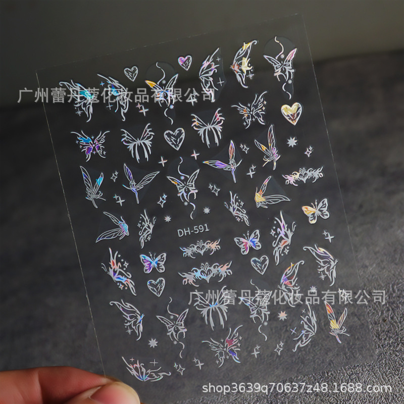 爆発的なネイルシールの上品な半透明な白い花びらの蝶のカラフルなオーロラガラスの破片には、ゴムの爪がついています|undefined