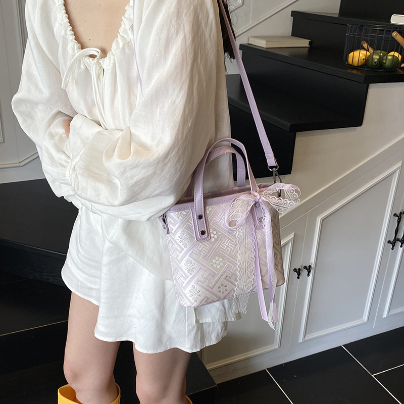 Bolso de cubo de agua súper fuego popular de verano para damas 2025 nuevo bolso de mano de tendencia salvaje bolso de mensajero de estilo nacional de sentido avanzado