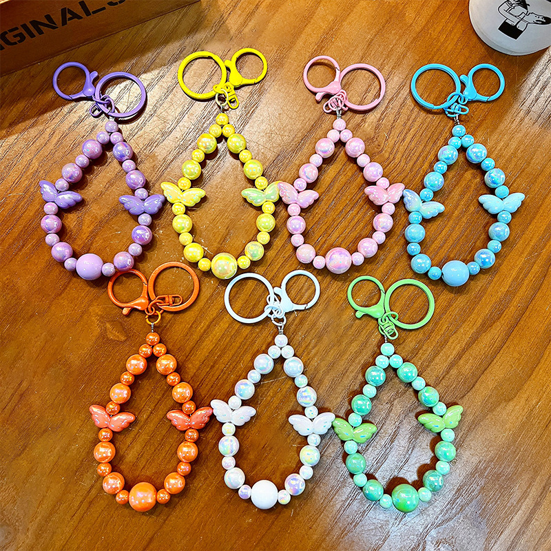 Sala de transmisión directa con alas recuerdos llaveros lindos colgantes de teléfonos móviles accesorios de bolsos llaveros de automóviles al por mayor