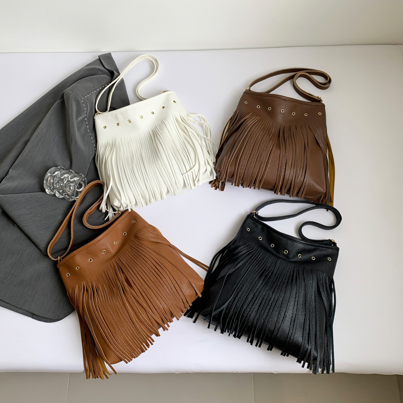 Bolsas de estilo nacional retro serie de mujeres 2024 verano nuevo bolso de moda explosivo bolso de mano de estilo perezoso