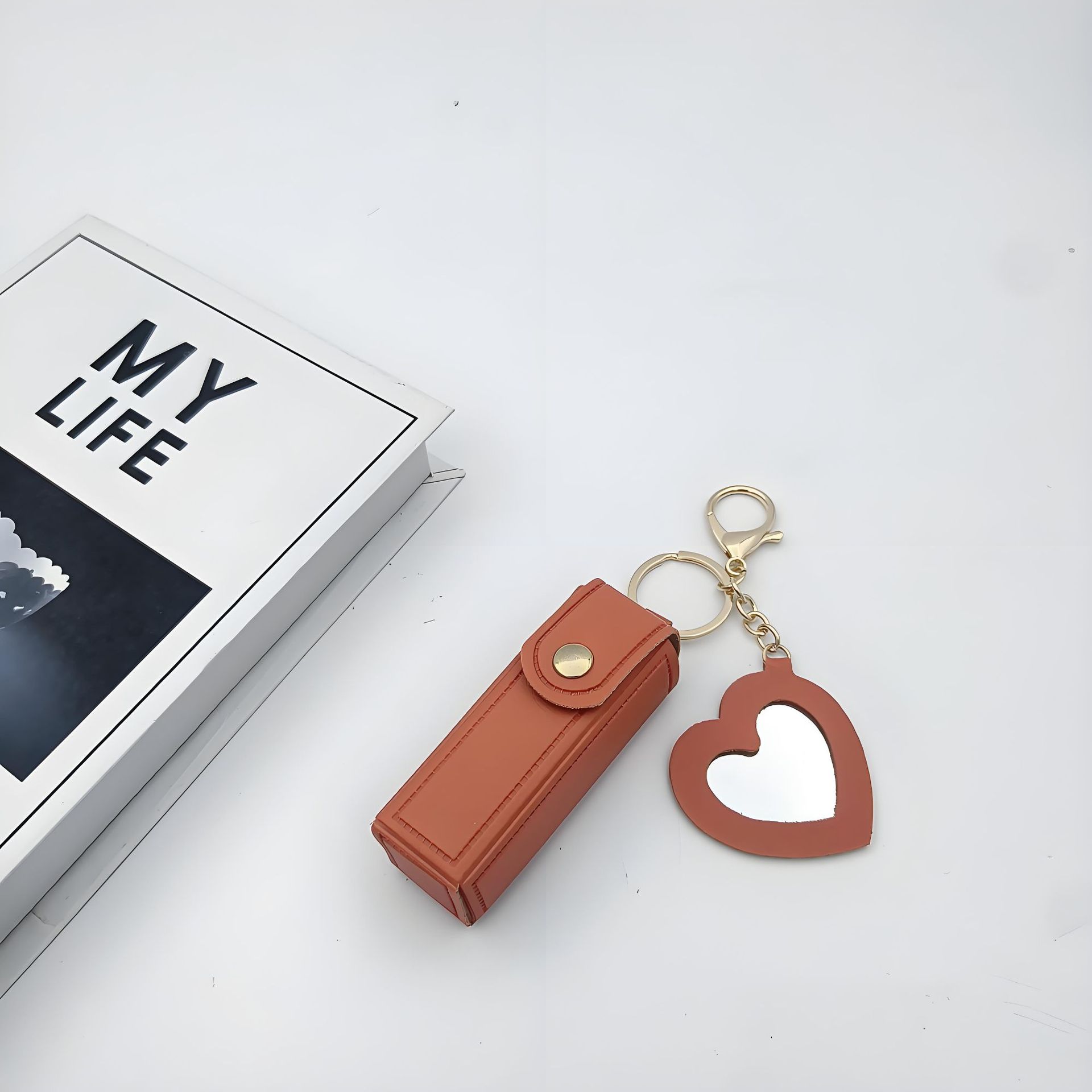 Bolso de cambio transfronterizo sobre rojo espejo creativo llavero colgante pequeño PU cuero bolso de coche accesorios accesorios en stock