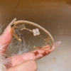 Golden white bracelet, flowered