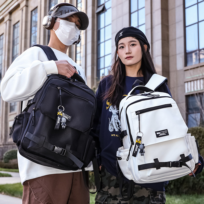 La nueva mochila de la marca de moda para hombres y mujeres de gran capacidad mochila de viaje ligera al aire libre para estudiantes de secundaria y secundaria.