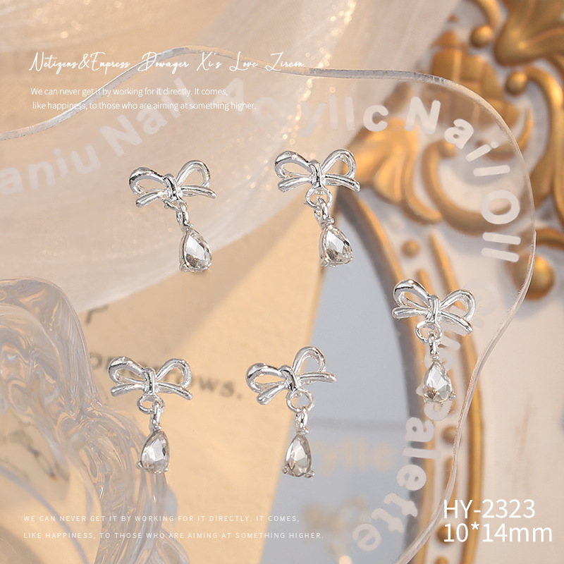 Nueva joyería de aleación de manicura completa diamante borla arco corona plata uñas manicura joyería accesorios al por mayor