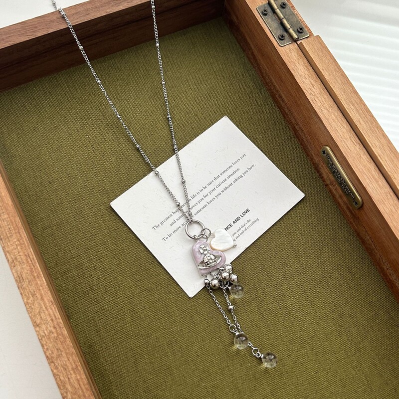 ダイヤモンドがちりばめられたラブレザーバッグペンダントロングネックレスレディースニッチデザインファッショナブルで多用途なセーターチェーン|undefined